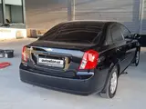 Черный Chevrolet Gentra, 3 позиция 2022 года, КПП Автомат, в Джизак за 14 000 y.e. id4317592, Фото №1