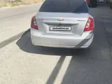 Серебристый Chevrolet Lacetti, 3 позиция 2013 года, КПП Автомат, в Самарканд за 6 700 y.e. id6665472, Фото №1