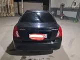 Черный Chevrolet Lacetti, 3 позиция 2005 года, КПП Механика, в Кызылтепинский район за ~6 715 y.e. id6429870, Фото №1