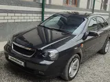Черный Chevrolet Lacetti, 3 позиция 2011 года, КПП Автомат, в Андижан за 6 500 y.e. id5027626, Фото №1